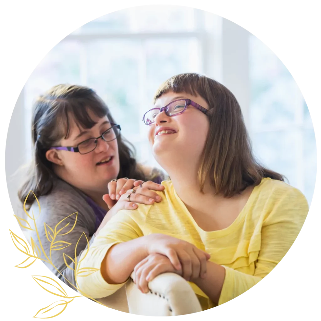 Two young down syndrome woman are happily spending time together